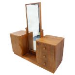 A mid 20th century Gordon Russell (plaque to back of plinth base) walnut dressing table of style and
