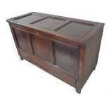 A large and heavy solid oak 19th century mule chest: the three-panelled scratch moulded lid on strap