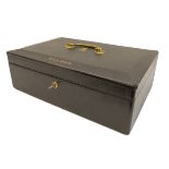 A black-leather-bound despatch box: the gilt-metal swan-neck handle above a Royal Cipher and named