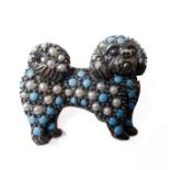 A gold brooch in the shape of a dog (possibly Japanese Chin or Shih Tzu) set with turquoises, pearls