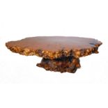 A fine and unusual burr yew-wood centre occasional table: the top formed from a section of wood