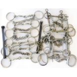A large selection of bits; four stainless steel (eggbutt snaffle 7”; Pelham with D ends 6”;