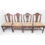 Four similar mahogany chairs in late 18th century Hepplewhite style: pierced splat, drop-in seats