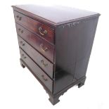 A late 18th century two-part mahogany chest: moulded top; four full-width graduated drawers with