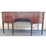 A large early 19th century mahogany sideboard: single central drawer; two left-hand drawers (the top