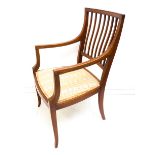 An Edwardian mahogany and satinwood, crossbanded open armchair on square, tapering boxwood strung