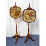 A matched and very near pair of mid-19th century walnut pole screens: both with shield-shaped carved