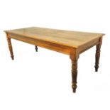 A pine farmhouse-style kitchen table; in late 19th / early 20th century style and of good colour and