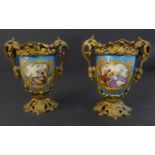 A pair of 19th century porcelain and gilt-metal-mounted two-handled vases (minus covers); hand