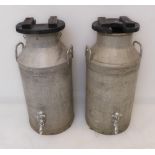 A pair of two-handled churns, each later fitted with ebonised plant pot holders and taps (75 cm