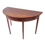 A George III period mahogany, bow-front D-end table: reeded-edge top with square tapering legs (