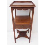 A Georgian-style mahogany bedside table: galleried top above a single, central drawer and raised