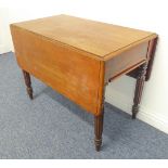 An early 19th century mahogany Pembroke table: single flush end-drawer; turned, tapering and