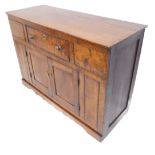 A 19th century oak dresser base of small proportions: slightly overhanging top above single drawer