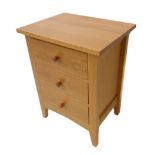 A modern oak bedside-style chest of three drawers (51 cm wide x 66 cm deep)