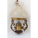 A reproduction Victorian ceiling-hanging lamp fitted for electricity