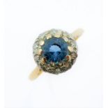 A blue topaz/aquamarine and diamond-set cluster ring: the circular mixed-cut blue topaz/