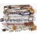 A quantity of costume jewellery to include a silver pencil and a travelling inkwell