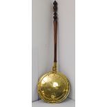 A good and large 19th century brass warming pan engraved with wrigglework: fixed to the turned