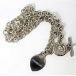 A heavy necklace with heart-style pendant (boxed), marked '925' (assumed to be silver but no