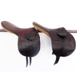 Two 16" leather, cloth-lined racing saddles