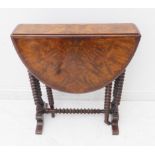 A 19th century oval-topped, figured walnut Sutherland table with bobbin-turned supports