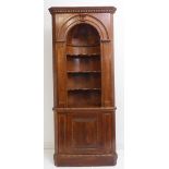 A good 18th-century-style stained-pine free-standing corner alcove-cupboard: dentil cornice above an