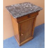 An early 20th century marble-topped French cherrywood bedside-style cabinet; the overhanging top