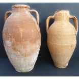 Two late 19th / early 20th century two-handled pottery amphorae (the larger 51 cm high)