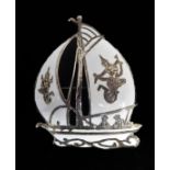 An unusual sterling silver and enamel brooch modelled as a yacht