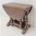 A small oval oak reproduction occasional table