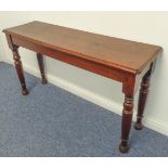 An oak console table in 19th century style, moulded top and turned tapering legs (137 cm wide x 40