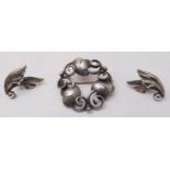 A Georg Jensen design silver-coloured brooch, together with a small pair of Jensen silver leaf-