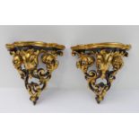 A pair of mid-20th century carved giltwood wall brackets, pierced and modelled as C-scrolls and