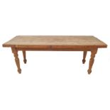 An early 20th century pine farmhouse-style kitchen table: the 5.5cm thick, three plank top above