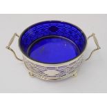 An Edward VII two-handled hallmarked silver butter-dish with circular cobalt-blue glass liner: