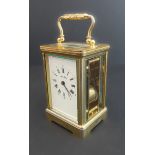 A fine 20th century (in 19th century style) gilt-metal and glass-sided carriage clock: the white-
