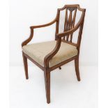 A late 18th century Sheraton period mahogany open armchair: the central pierced splat surmounted