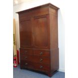 A large 18th century mahogany linen press: the cornice with Hepplewhite-style arcading above two