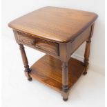 A good Ercol elm bedside-style table: single full-width drawer, turned supports united by a