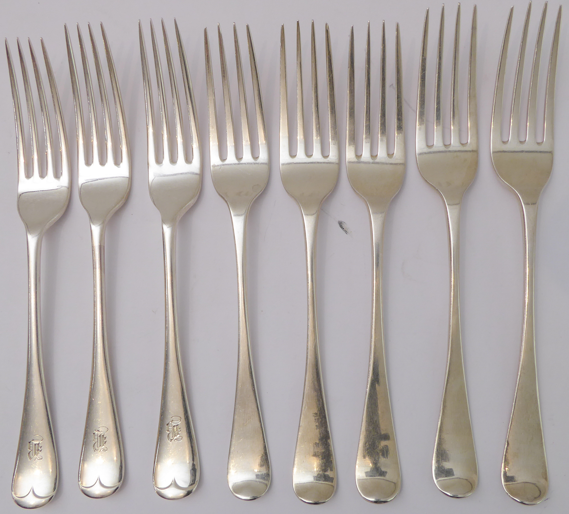 A harlequin set of eight early to mid 19th century hallmarked silver table-forks: various assay