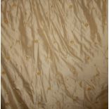 A pair of gold heavy silk curtains with embroidered floral motifs embellished with velvet and