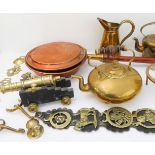 A interesting selection of metalware to include: two early 20th century range kettles; a trivet,