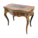 A 19th century ormolu-mounted kingwood and marquetry card table: serpentine-front and foldover