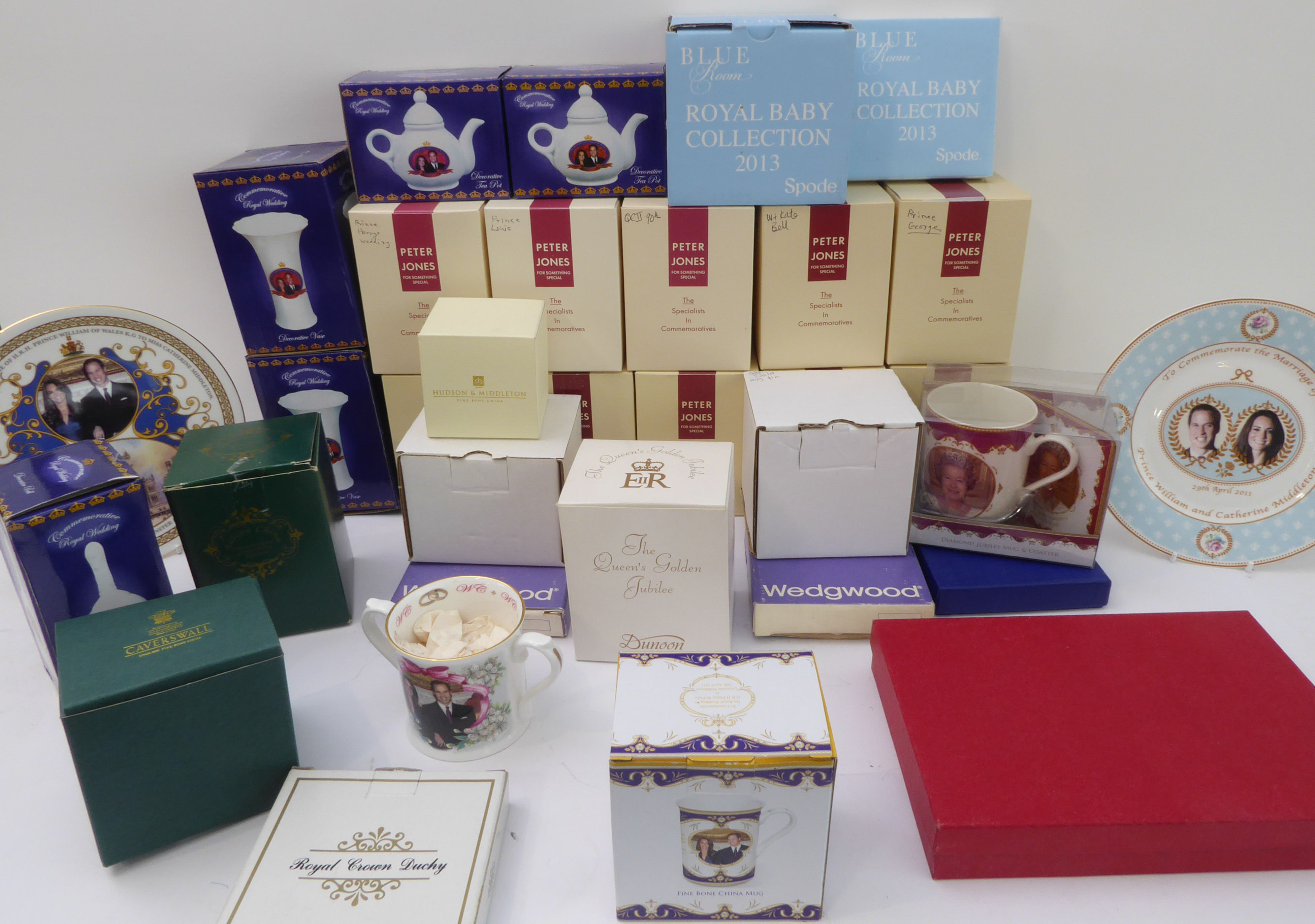 Thirty boxed pieces of royal commemorative porcelain and three unboxed. Mostly mugs and to include