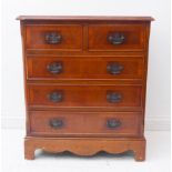 A reproduction Georgian-style mahogany chest: flame-veneered, crossbanded, moulded top above two