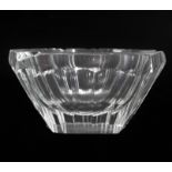 A deep-bowled hexagonal cut-glass ashtray with fluted sides (14.3 x 7 cm)