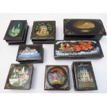 An interesting selection of eight hand-decorated Russian papier-mâché boxes including swans in