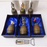 Six Sterling Classic pewter bottle-stoppers on barrel stands and a bottle-opener: 'The Finish'; '
