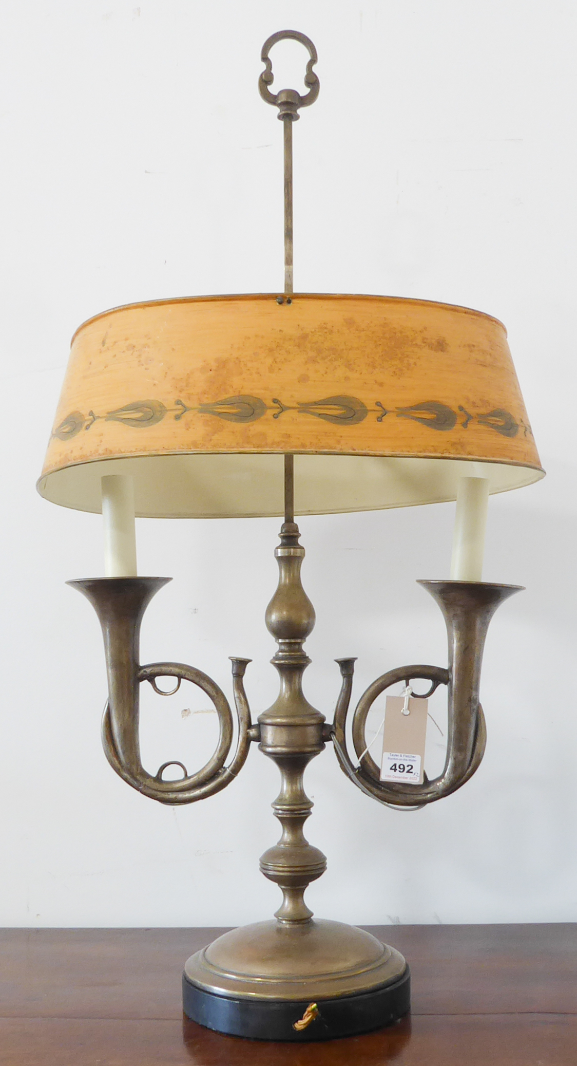 A good quality solid metal (possibly steel) lamp together with a painted Toleware shade (adjustable)